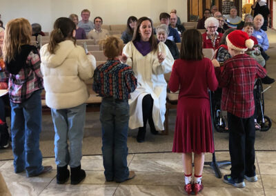 Pictured: Children singing during worship, led by Trinity Presbyterian Church music director, Diana Taylor.